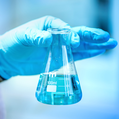 image of person holding testing tube