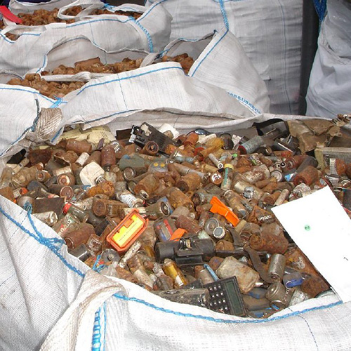 image of old rusty batteries going through a recycle process