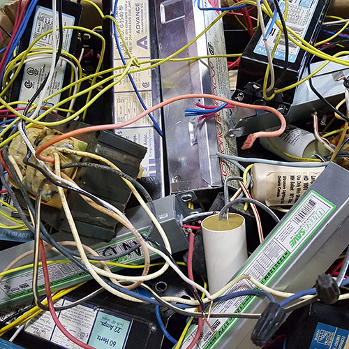 image of obsolete electronics like cables, capacitors, batteries, etc