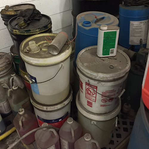 image of containers with ued oil ready to be recycled